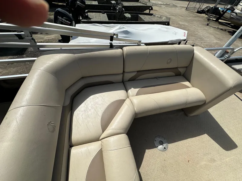 Slide: The Image of 2014 Lowe SF214 Sport Fish boat with beige seating on deck. - 13