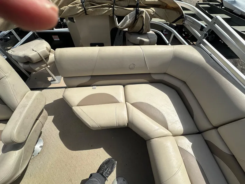 Slide: The Image of 2014 Lowe SF214 Sport Fish boat with beige seating and interior. - 14