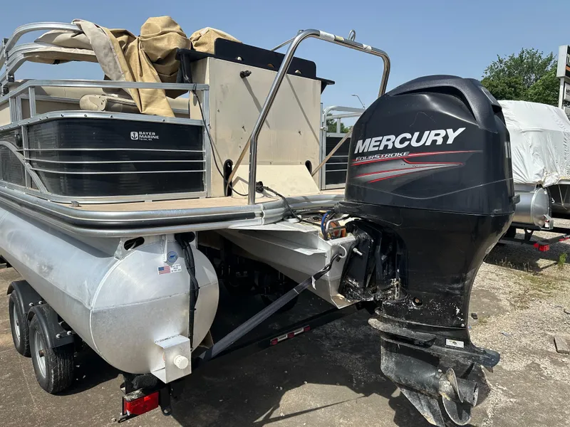 Slide: The Image of 2014 Lowe SF214 Sport Fish boat with Mercury outboard motor on trailer. - 4