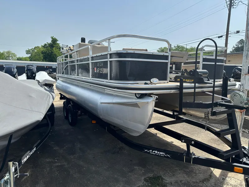Slide: The Image of 2014 Lowe SF214 Sport Fish pontoon boat on trailer in outdoor setting. - 5