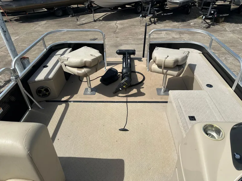 Slide: The Image of 2014 Lowe SF214 Sport Fish boat interior with seating and fishing equipment. - 9