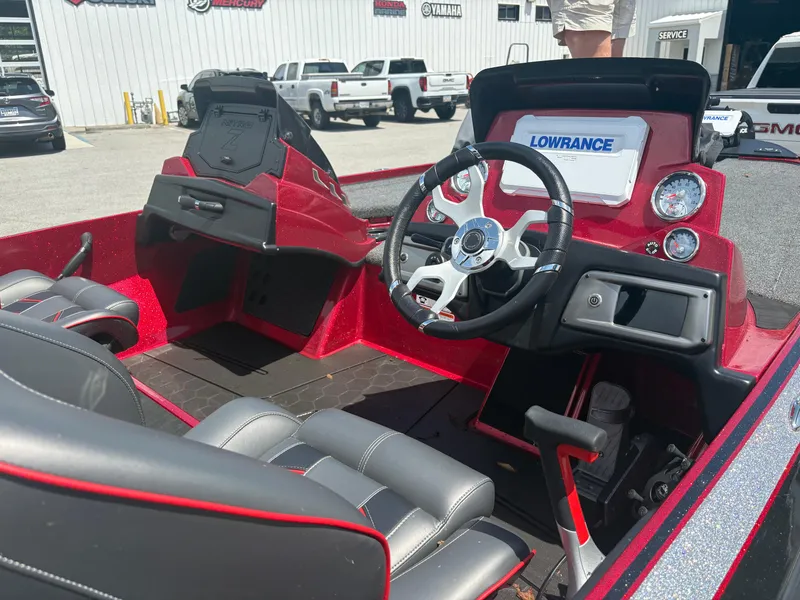 Slide: The Image of 2024 Nitro Z19 boat interior with steering wheel and Lowrance display. - 6