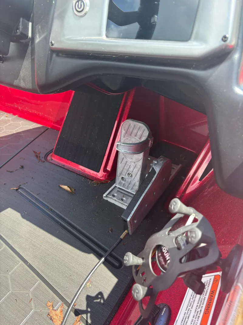 Slide: The Image of 2024 Nitro Z19 boat cockpit with pedal controls and steering components. - 8