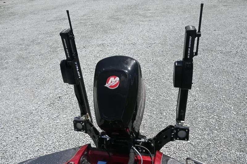 Slide: The Image of 2016 Ranger Z518 boat engine with dual Power-Pole anchors on gravel surface. - 11