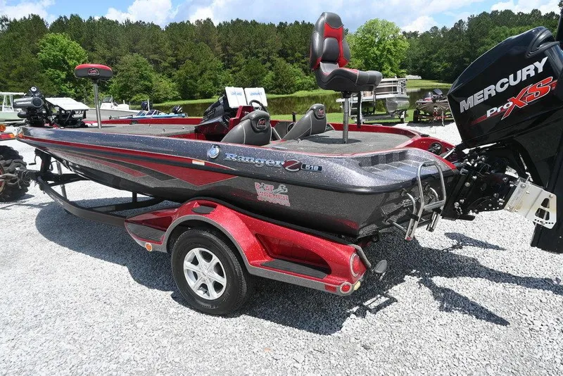 Slide: The Image of 2016 Ranger Z518 boat with Mercury Pro XS engine on a red trailer. - 2
