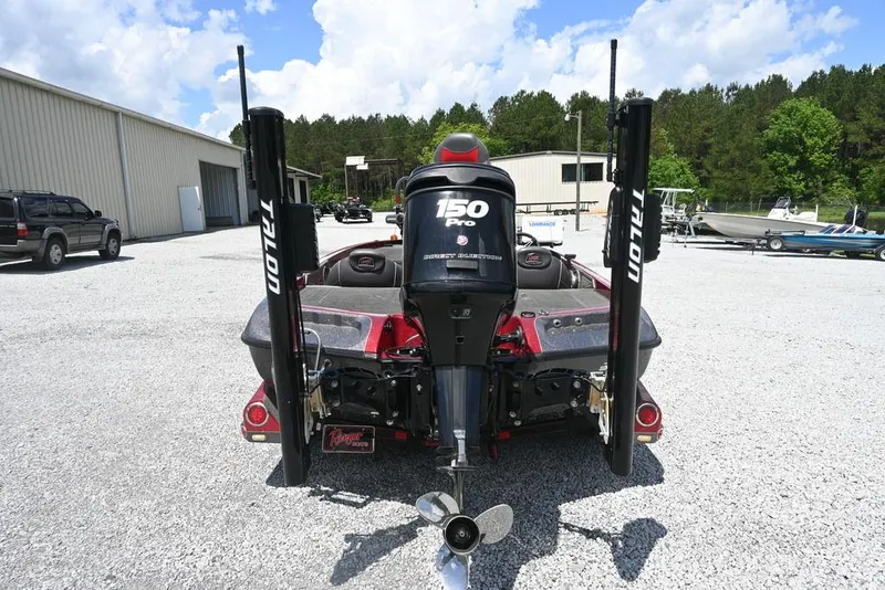 Slide: The Image of 2016 Ranger Z518 boat with 150 Pro motor, parked outdoors on gravel. - 3