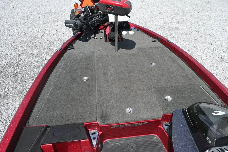 Slide: The Image of 2016 Ranger Z518 boat deck with red trim and mounted equipment. - 6
