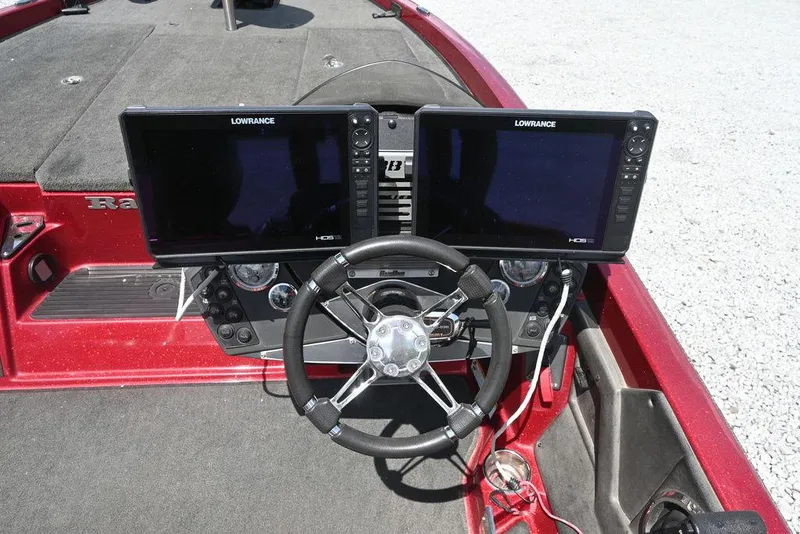 Slide: The Image of 2016 Ranger Z518 boat dashboard with dual Lowrance displays and steering wheel. - 7