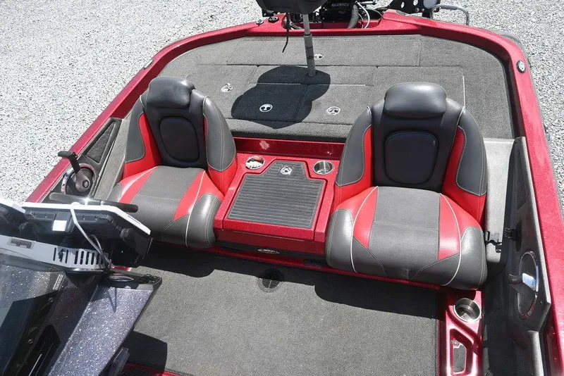 Slide: The Image of 2016 Ranger Z518 boat interior with red and black seats, spacious layout. - 8