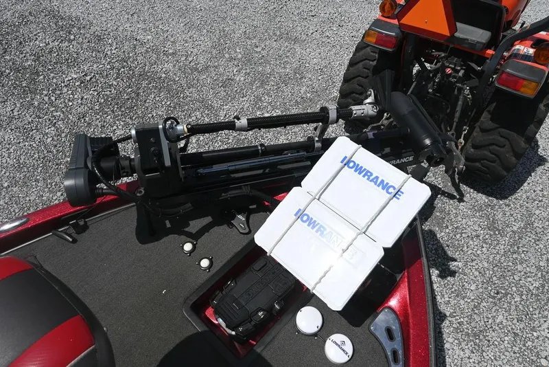 Slide: The Image of 2016 Ranger Z518 boat with Lowrance equipment and a tractor in the background. - 9