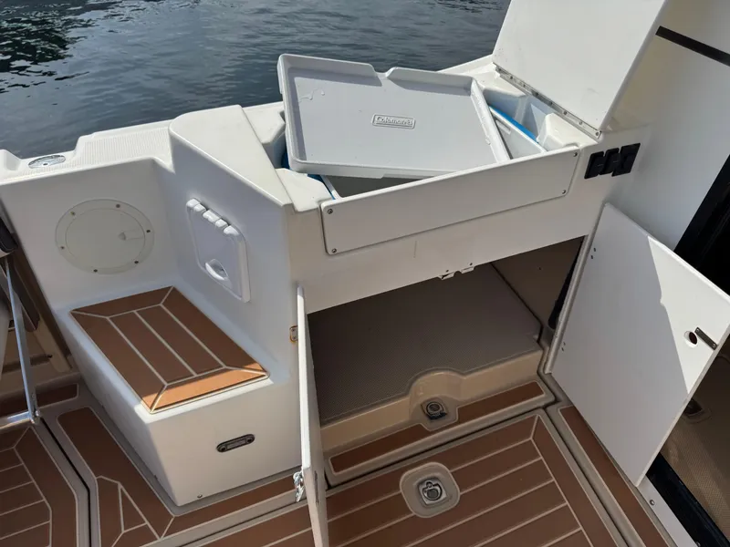 Slide: The Image of 2014 Cutwater C-28 Coupe boat interior with storage compartments and seating area. - 11