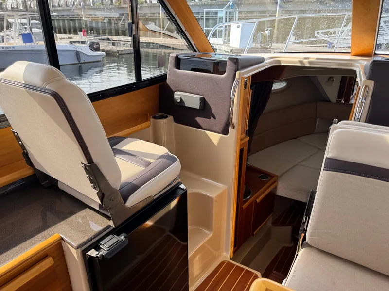 Slide: The Image of Interior of 2014 Cutwater C-28 Coupe boat with seating and cabin view. - 18