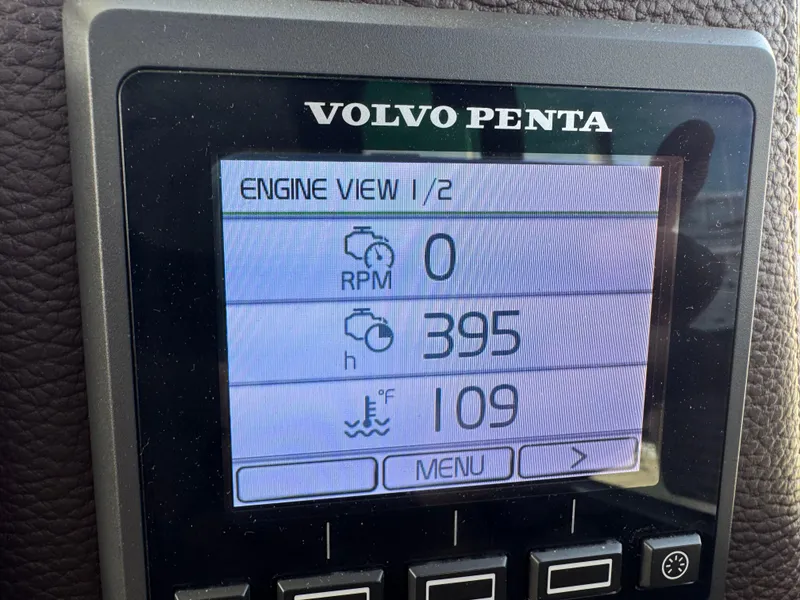 Slide: The Image of Volvo Penta engine display on 2014 Cutwater C-28 Coupe showing RPM, hours, and temperature. - 25