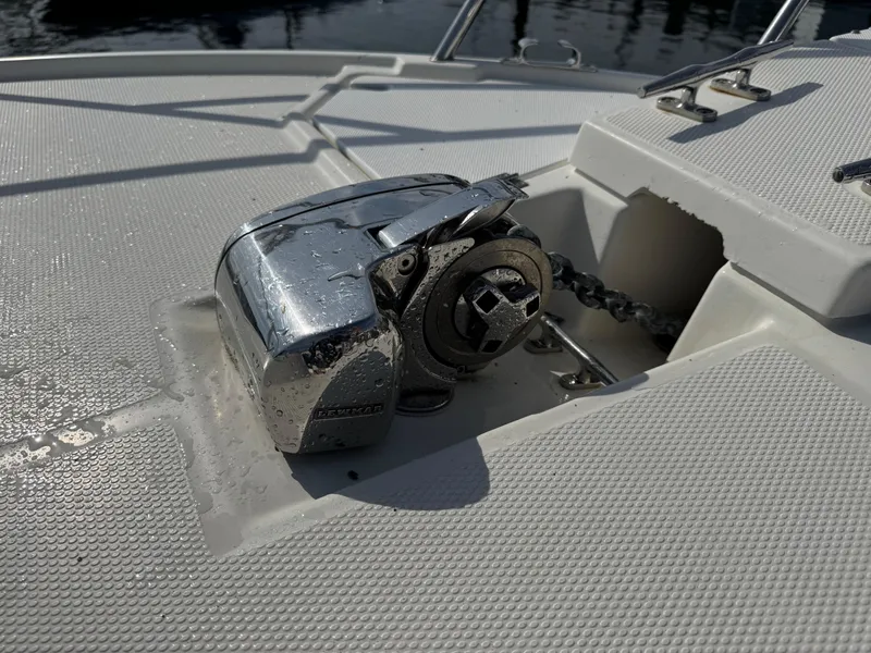 Slide: The Image of Anchor winch on 2014 Cutwater C-28 Coupe boat deck, with chain visible. - 34