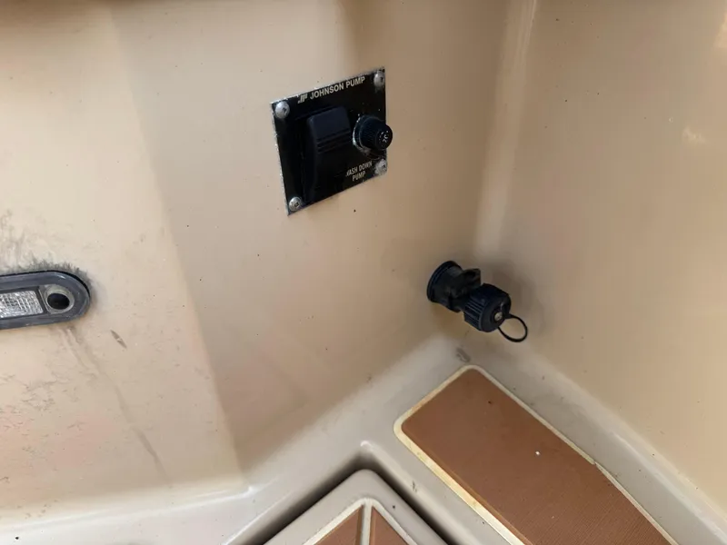 Slide: The Image of 2014 Cutwater C-28 Coupe interior detail with Johnson pump control and outlet. - 48