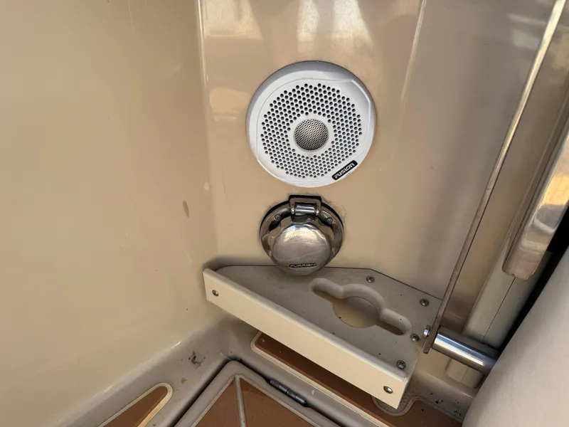 Slide: The Image of 2014 Cutwater C-28 Coupe interior detail with speaker and cup holder. - 49