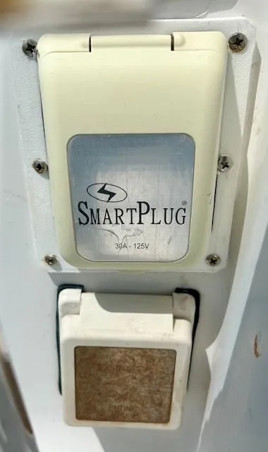 Slide: The Image of SmartPlug outlet on 2007 Hanse 400 sailboat, 30A 125V, white cover. - 13