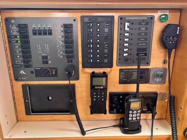 Slide: The Image of Control panel of a 2007 Hanse 400 yacht with communication devices and switches. - 14