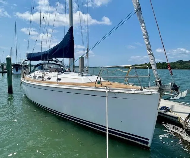 Slide: The Image of 2007 Hanse 400 sailboat docked in a marina under a clear blue sky. - 2