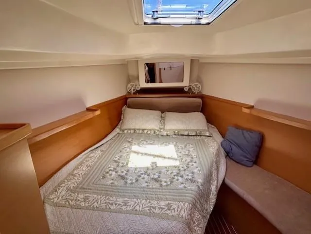 Slide: The Image of Cozy cabin interior of 2007 Hanse 400 yacht with skylight and comfortable bedding. - 21