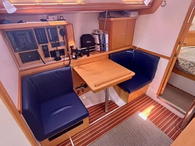 Slide: The Image of Interior of 2007 Hanse 400 yacht with navigation station and seating area. - 22