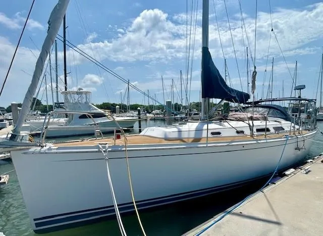 Slide: The Image of 2007 Hanse 400 sailboat docked at marina under blue sky. - 3
