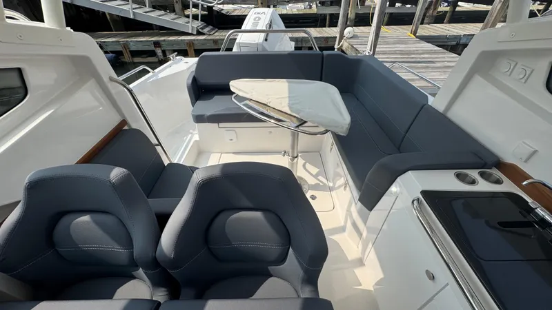 Slide: The Image of 2024 Nimbus W9 boat interior with seating, table, and modern design. - 14