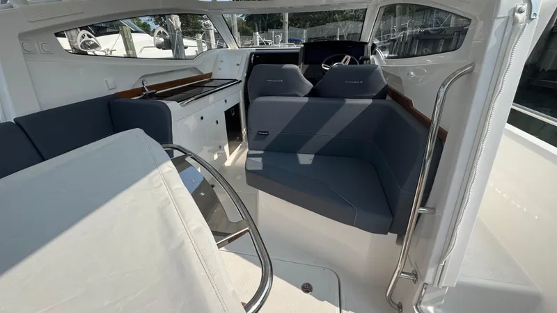 Slide: The Image of 2024 Nimbus W9 boat interior with modern seating and sleek design. - 9