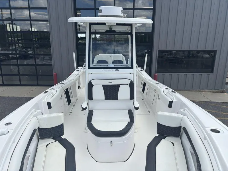 Slide: The Image of 2024 Tidewater 256 CC Adventure boat with sleek white interior and modern design. - 15