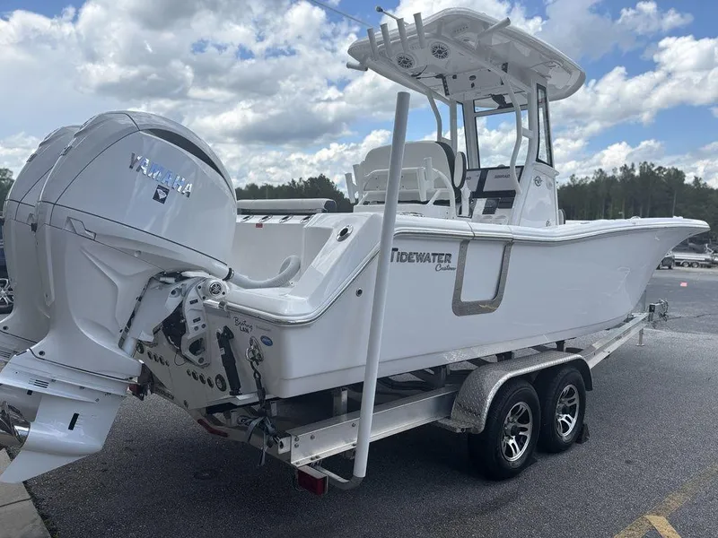 Slide: The Image of 2024 Tidewater 256 CC Adventure boat on trailer, featuring a powerful Yamaha outboard motor. - 20
