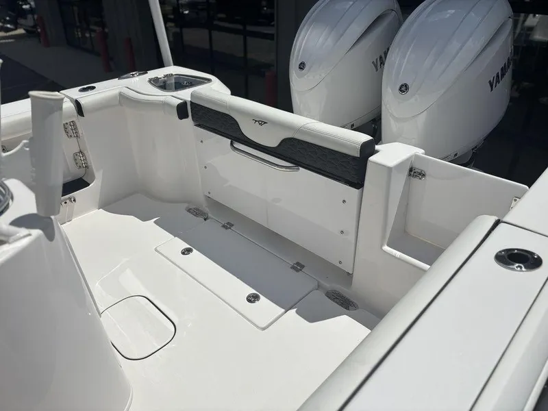 Slide: The Image of 2024 Tidewater 256 CC Adventure boat interior with dual Yamaha engines. - 3