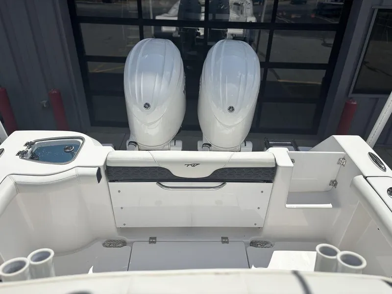 Slide: The Image of 2024 Tidewater 256 CC Adventure boat with dual engines, rear view. - 4