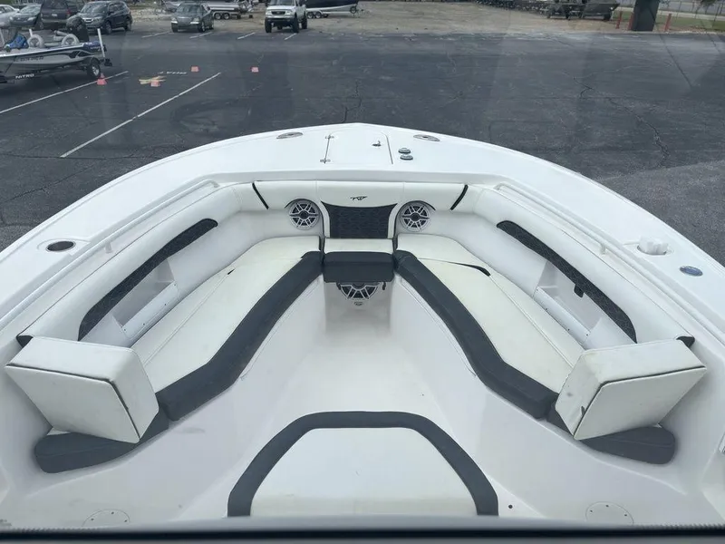 Slide: The Image of 2024 Tidewater 256 CC Adventure boat with spacious seating and modern design. - 5