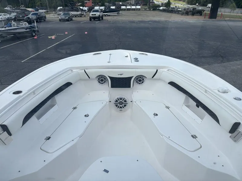 Slide: The Image of 2024 Tidewater 256 CC Adventure boat interior with seating and speakers. - 6