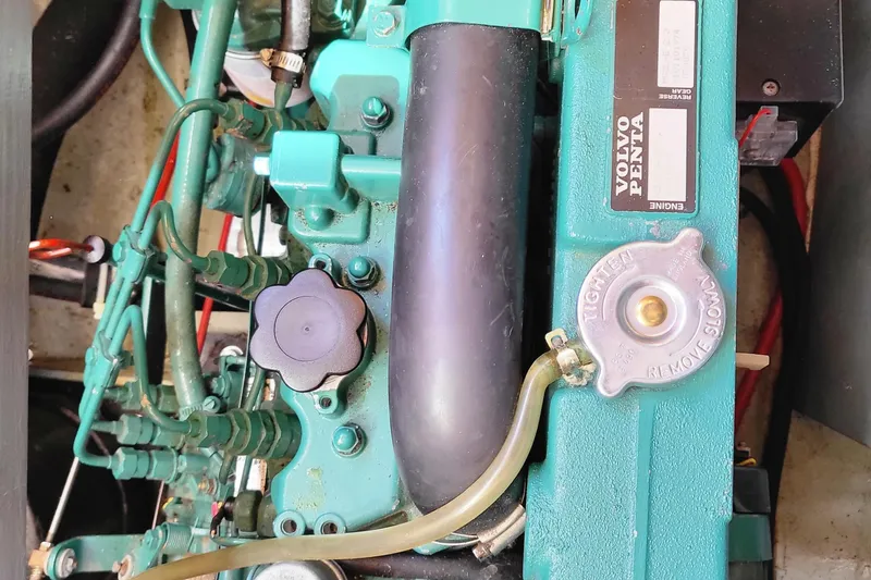Slide: The Image of 1978 Fisher 25 engine, Volvo Penta, detailed view of components and hoses. - 31