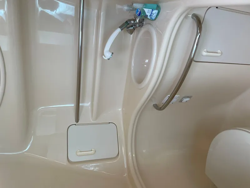 Slide: The Image of Interior of 2001 Sea Ray 340 Sundancer boat bathroom with sink and handrail. - 16