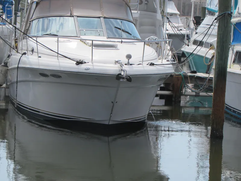 Slide: The Image of 2001 Sea Ray 340 Sundancer yacht docked in a marina. - 4
