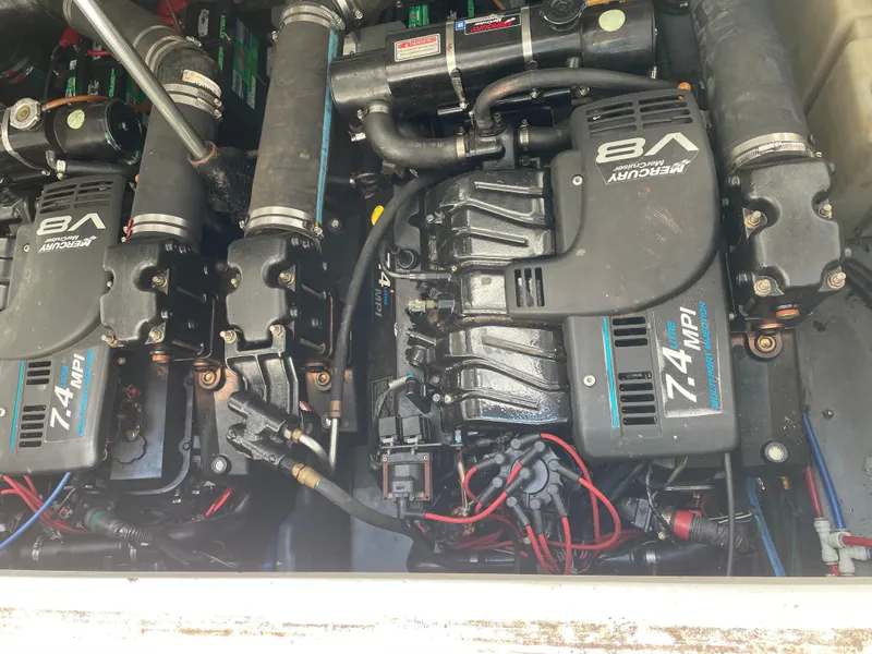 Slide: The Image of Engine compartment of a 2001 Sea Ray 340 Sundancer with twin Mercury V8 engines. - 8