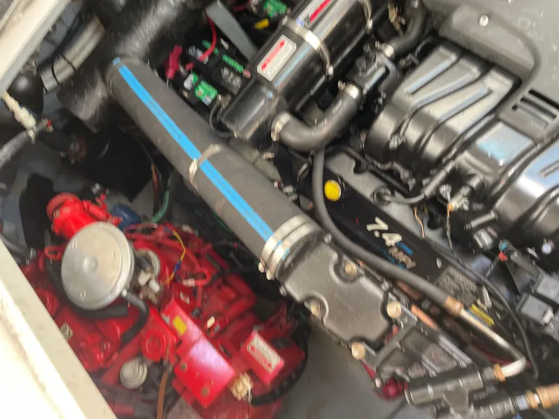 Slide: The Image of Engine compartment of a 2001 Sea Ray 340 Sundancer boat, featuring detailed mechanical components. - 9