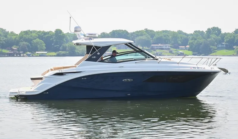 Slide: The Image of 2020 Sea Ray Sundancer 320 Coupe cruising on a serene lake. - 0