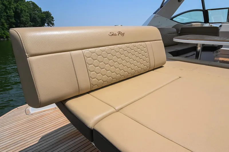 Slide: The Image of Luxurious seating on 2020 Sea Ray Sundancer 320 Coupe boat, featuring elegant beige upholstery. - 10