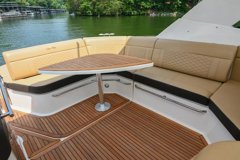 Slide: The Image of Luxurious seating area on 2020 Sea Ray Sundancer 320 Coupe yacht with wooden deck. - 16