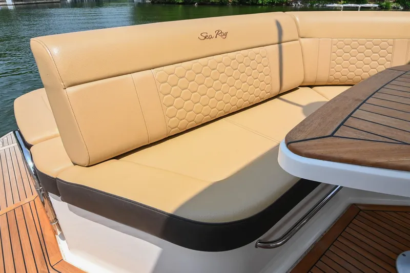 Slide: The Image of Luxurious seating on 2020 Sea Ray Sundancer 320 Coupe, featuring elegant tan upholstery. - 18