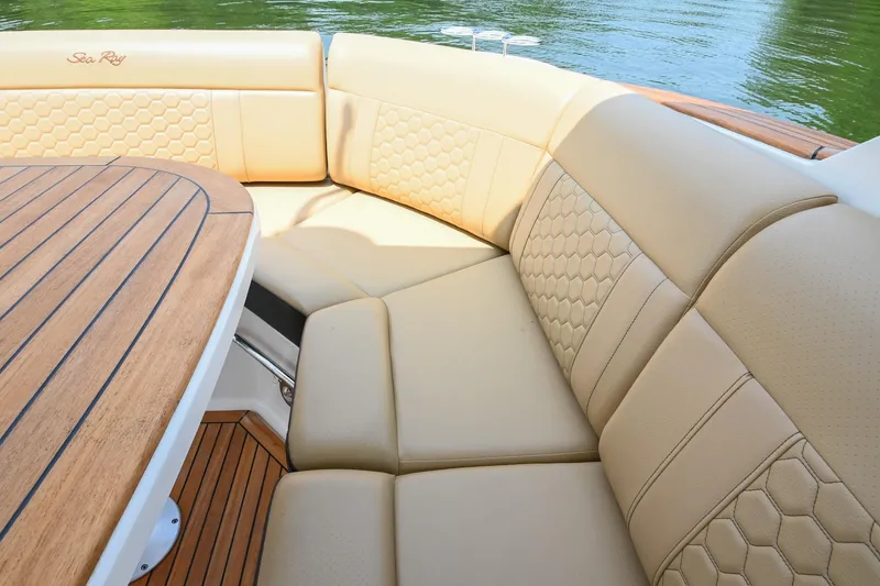 Slide: The Image of Luxurious seating on 2020 Sea Ray Sundancer 320 Coupe with elegant upholstery and wooden table. - 20