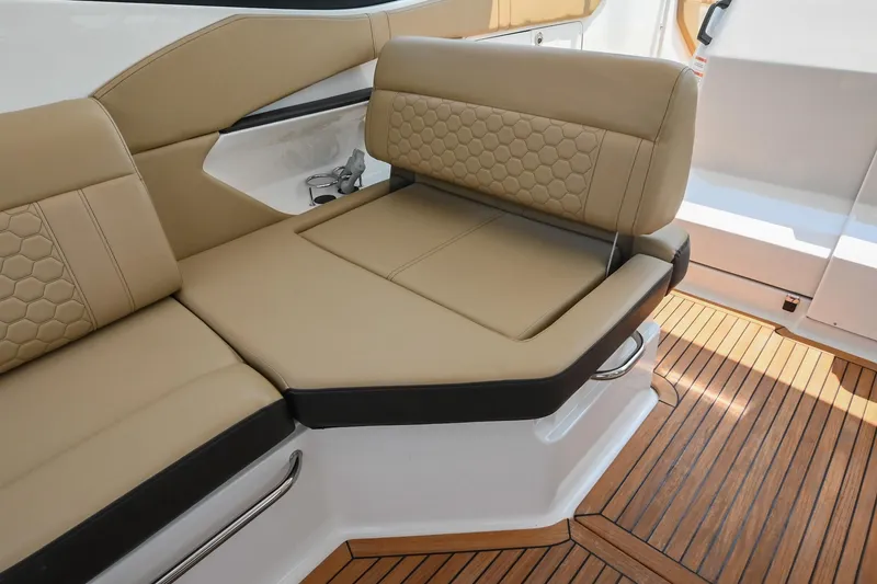 Slide: The Image of Luxurious seating on 2020 Sea Ray Sundancer 320 Coupe with teak flooring. - 22