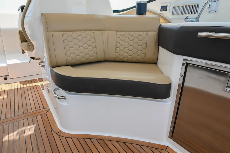 Slide: The Image of Luxurious seating on 2020 Sea Ray Sundancer 320 Coupe with elegant wood flooring. - 23