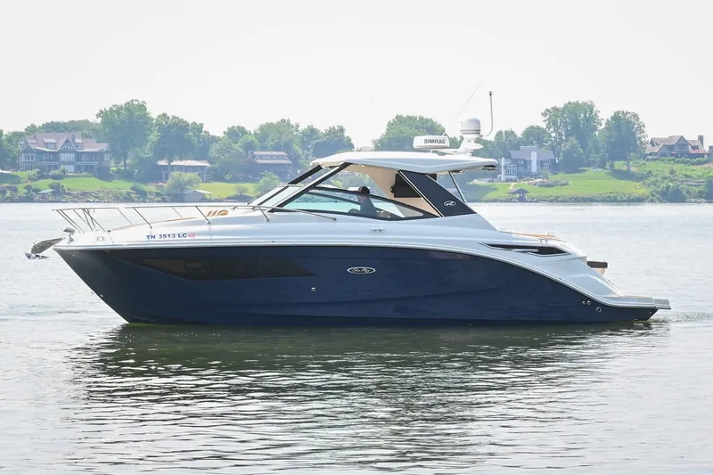 Slide: The Image of 2020 Sea Ray Sundancer 320 Coupe cruising on a calm lake. - 3
