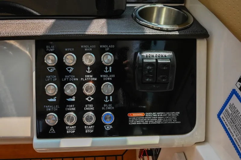 Slide: The Image of Control panel of 2020 Sea Ray Sundancer 320 Coupe with various boat function buttons. - 32