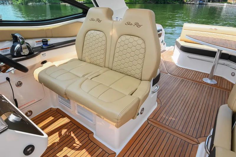 Slide: The Image of 2020 Sea Ray Sundancer 320 Coupe interior with beige leather seating and wooden flooring. - 35