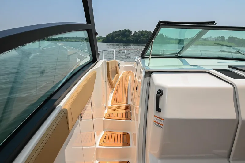 Slide: The Image of 2020 Sea Ray Sundancer 320 Coupe deck with teak steps and glass windshield. - 36